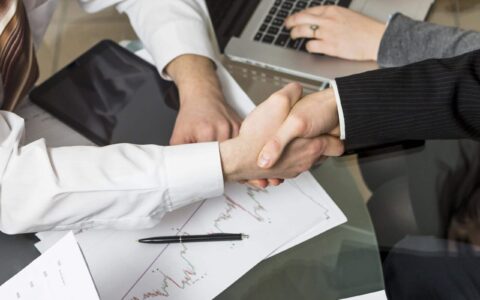 close-up-two-businesspeople-shaking-hands
